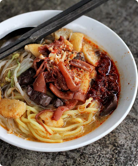 Tourist Eating White Curry Mee
